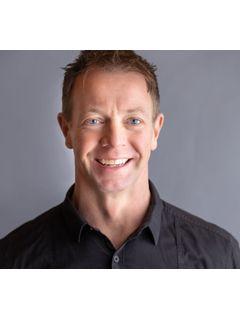 Dustin Beckwith of CENTURY 21 Woods To Water Realty photo